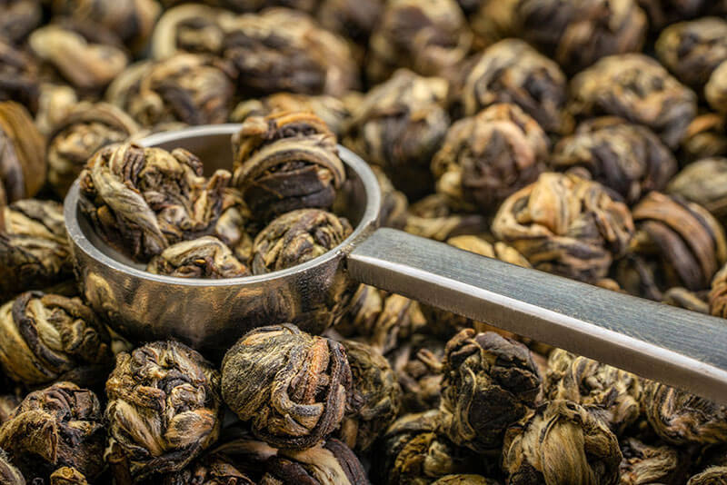 Jasmine flowers rolled with green tea leaf into jasmine pearls