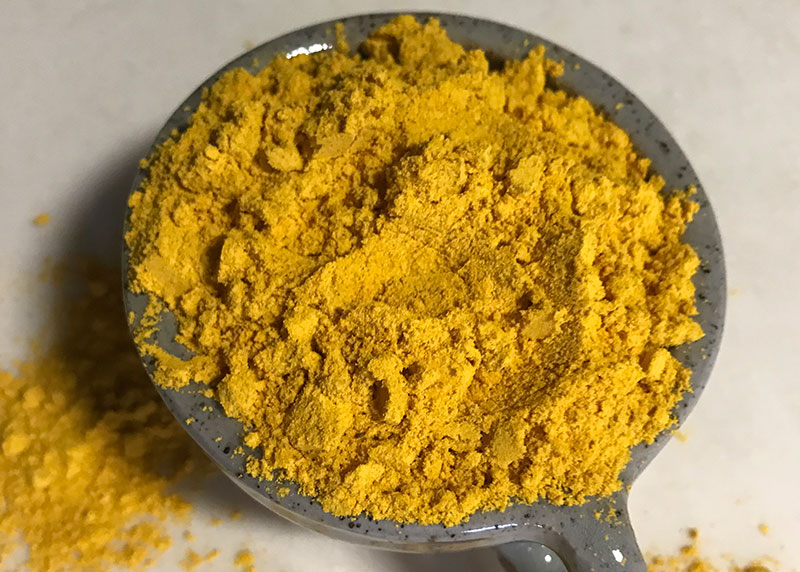 Turmeric that gives the bright orange color in Thai tea