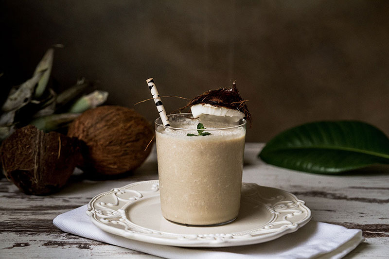 smoothie on a saucer with coconuts