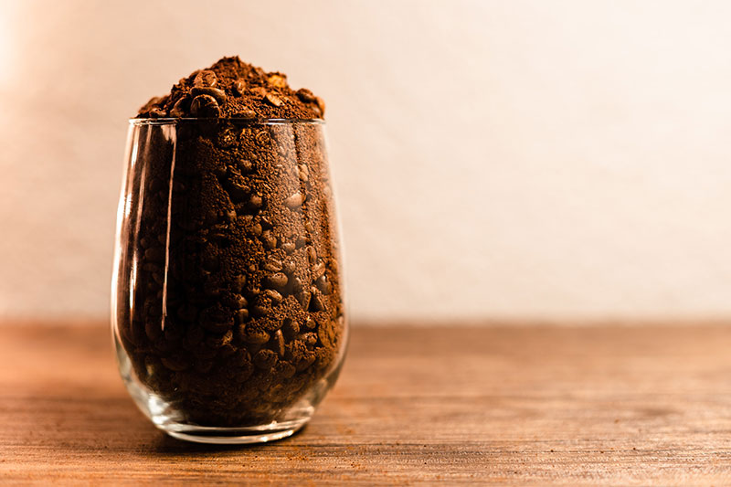 coffee grounds in a clear glass