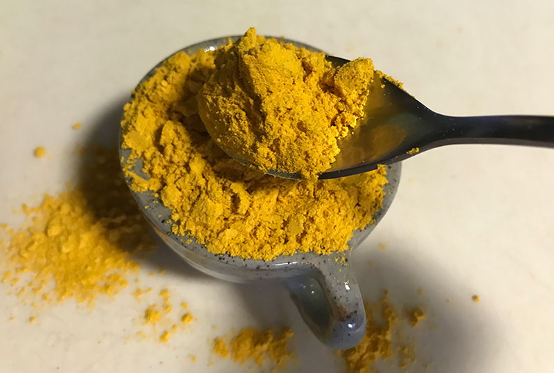 Add some turmeric to Thai tea to make it orange in color