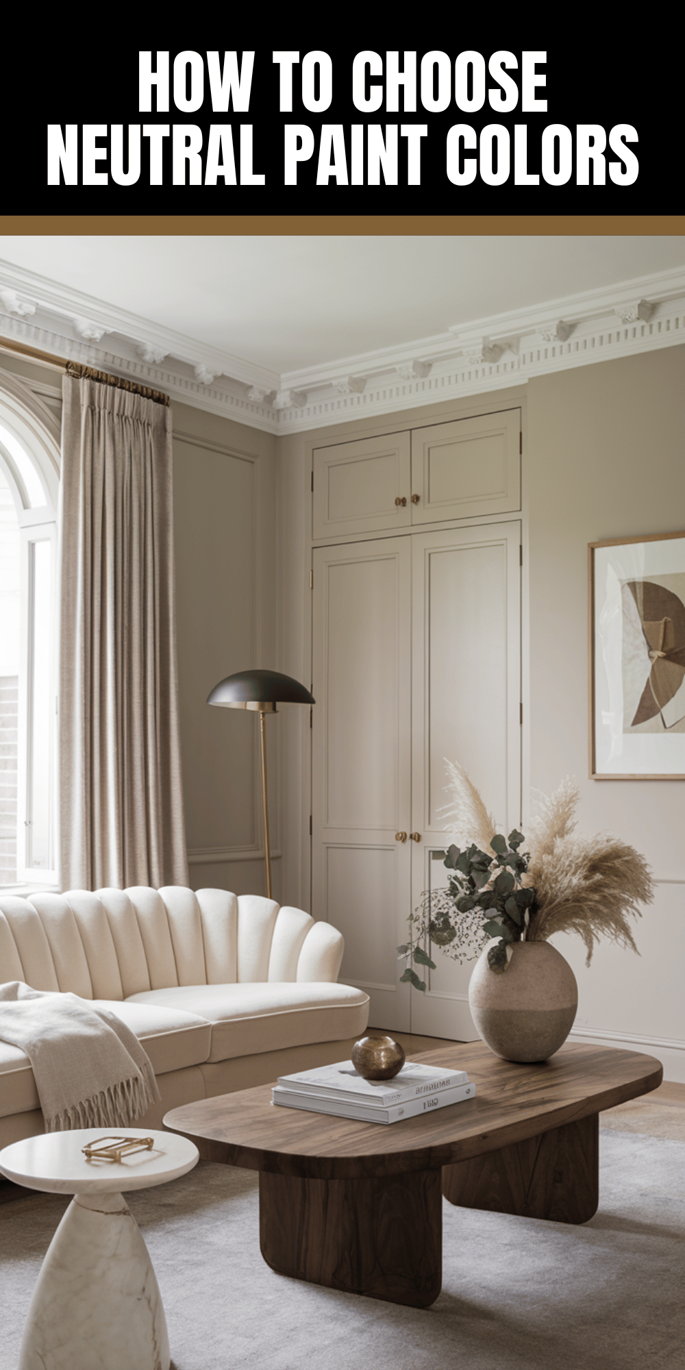 Elegant living room with neutral tones, featuring plush sofa, wooden coffee table, and large window. Text: “How to Choose Neutral Paint Colors.”