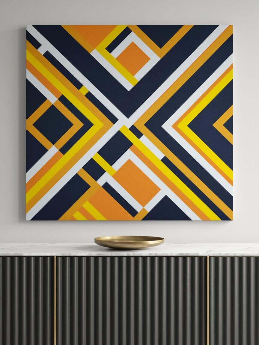 A geometric abstract painting with bold orange and navy patterns hangs above a sleek sideboard with a decorative golden bowl.