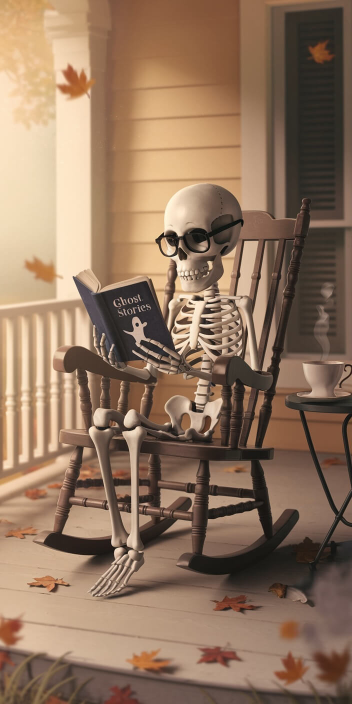 A skeleton, wearing glasses, reads "Ghost Stories" while sitting in a rocking chair on a porch surrounded by autumn leaves.