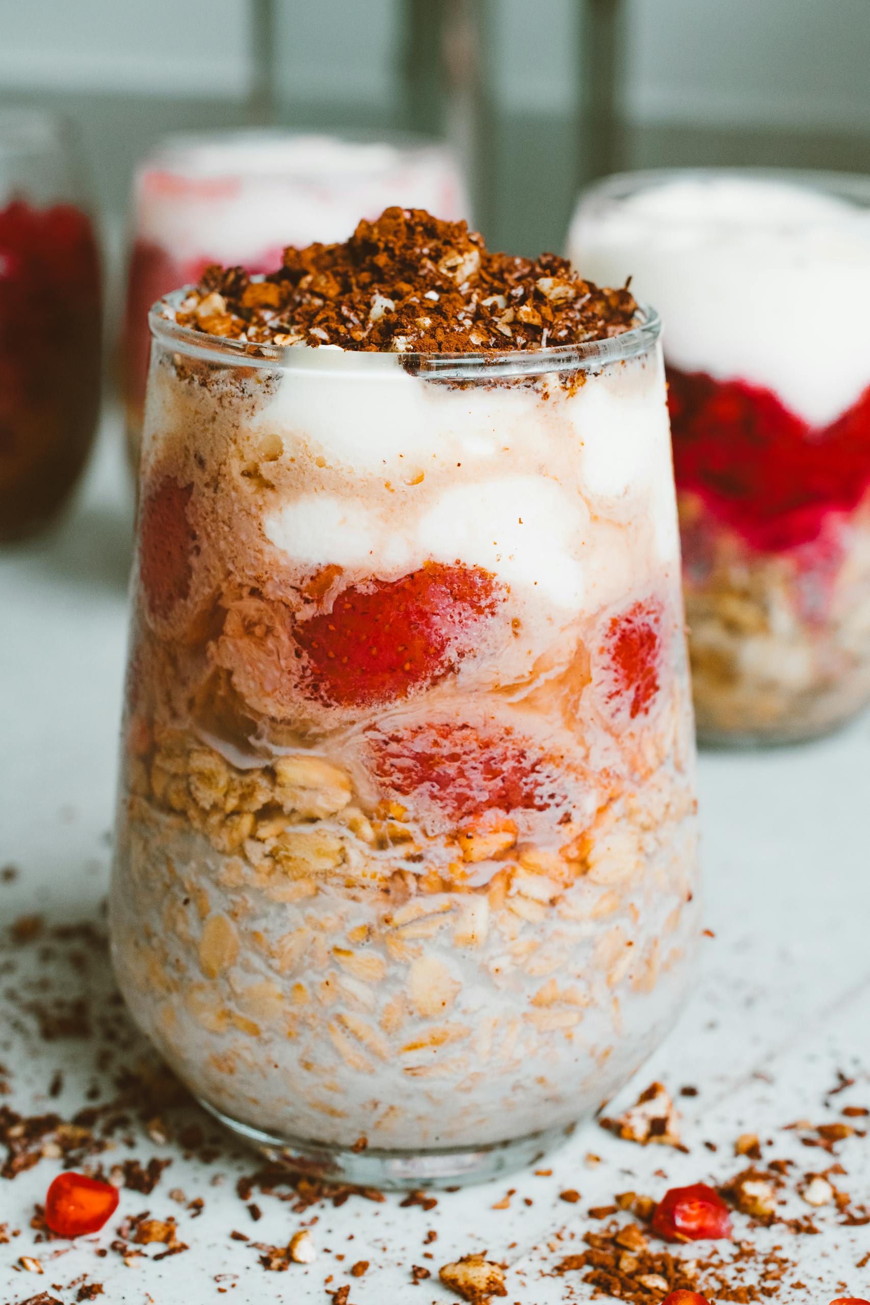 A delectable breakfast parfait with layers of berries, granola, and creamy yogurt in a glass.