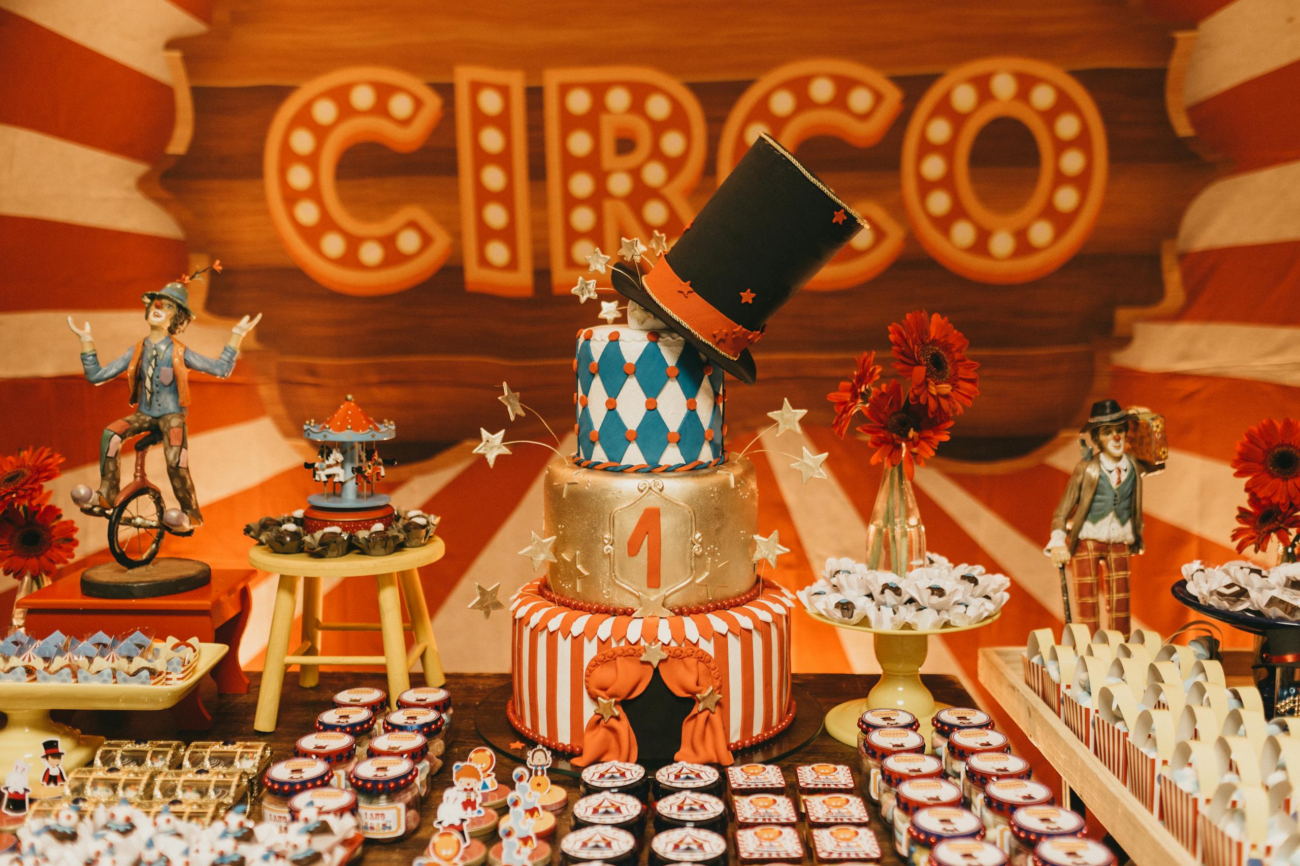 Vibrant circus-themed birthday party setup featuring a themed cake and colorful decorations.